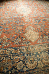 Distressed Vintage Mahal Carpet: Dark teal border and pale rust field with palmette finials.