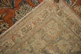 Hand-knotted backing texture and rust floral motifs of a vintage distressed Mahal rug.