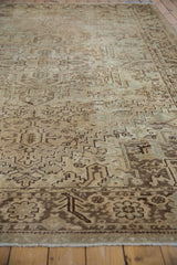 Distressed low pile Heriz, geometric motifs in ivory, beige, and coffee brown.