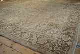 Distressed vintage Heriz carpet, geometric tendrils in antique ivory and coffee brown, low pile.