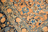 Distressed vintage Meshed carpet showing blue palmettes and subtle foundation wear.