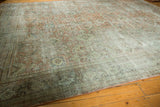 Distressed Vintage Mahal carpet section, with faded dusty rose, charcoal patterns and even wear.