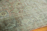 Distressed vintage Mahal texture showing faded rose, pale sage, and ivory wear.