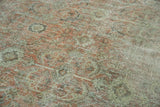 Distressed vintage Mahal rug with faded blush, beige, and charcoal geometric motifs.