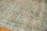 Distressed Mahal rug showing faded geometric Herati motif, with soft blush and pale beige tones.