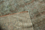 Close-up of distressed Mahal carpet pile, with visible foundation and secured edge.