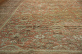 Distressed vintage Mahal rug with faded blush rose and sea foam green traditional floral pattern.