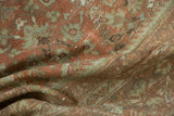 Folded pile detail of distressed vintage Mahal rug, showing faded palmettes in dusty blush and sea foam.