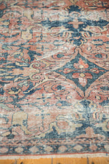 Distressed Persian Mahal carpet texture, with faded blush, teal, navy, and sand scrolling floral motifs.