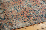 Distressed Mahal carpet's worn pile texture showcasing dusty red and navy scrolling floral patterns.