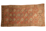 Antique Afghan runner, large-scale stylized boteh motifs, chestnut terracotta and oxidized silver.