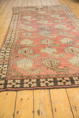 Afghan runner detail: stylized boteh in terracotta, oxidized silver, and chocolate border.