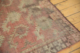 Antique Afghani rug corner showing worn simplistic boteh pattern, geometric border, and foundation.