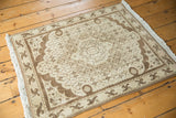 Chocolate brown floral arabesque border and intricate Herati design on a vintage Bijar rug.