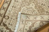 Ivory fringe and woven underside of a vintage Bijar rug, revealing intricate Herati pattern.