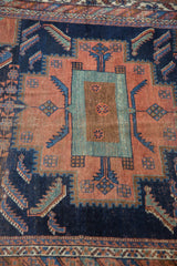 Antique Afshar rug with stepped geometric medallion, Herati motifs, terracotta, navy, celadon.