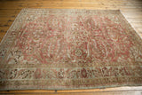 Distressed Lilihan rug border with faded floral motifs and low pile texture.