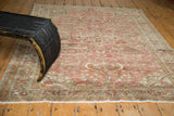 Distressed Lilihan rug's lower field, showcasing a beautiful patina and muted copper floral patterns.