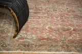 Distressed Lilihan rug's low pile, visible knot heads, copper, pale bronze and ivory floral patterns.