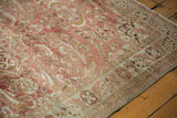 Vintage distressed Lilihan rug corner, showing pale bronze border and varied pile texture.