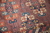 Staggered guls and even low pile on the abrashed plum field of this late 19th-century Turkmen rug.