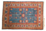 Vintage Khotan carpet, sapphire blue field, floral palmette motif, gold, red borders, 6x9.