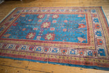 Vintage Khotan carpet field with sapphire blue, long-stemmed floral palmettes.