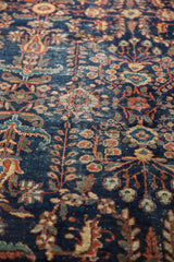Detailed antique Persian Mahal carpet, showcasing time-softened floral motifs and low pile.