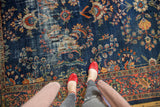 Vintage Mahal carpet detail, showing floral tendrils and worn cobalt blue field.