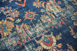 Worn cobalt blue pile, exposed foundation, and mended patches on vintage Mahal rug.