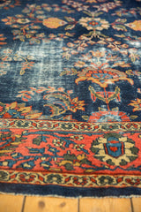 Vintage Mahal carpet with worn cobalt blue field, floral tendrils, and patterned terracotta border.