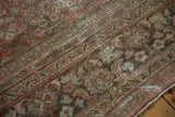 Decorative distressed Mahal rug surface, showcasing worn copper chestnut and exposed foundation.
