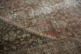 Distressed pile of the Vintage Mahal rug, with copper henna plant motif and visible knot heads.
