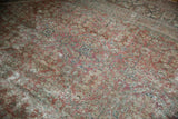 Distressed Mahal carpet pile, revealing areas of foundation with muted copper and blue.