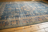 Worn royal blue field and faded terracotta floral border detail of a Vintage Sparta rug.