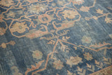 Faded royal blue distressed Sparta carpet texture with terracotta motifs and exposed foundation.