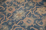 Distressed vintage Turkish Sparta rug with faded royal blue and terracotta geometric floral pattern.