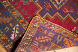Sharp serrated main border and tight weave of a vintage Turkish rug corner.