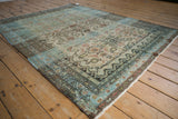 Vintage Distressed Hamadan rug showing faded Herati Mahi motif with soft blue abrashes.