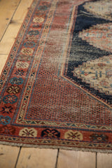 Antique Afshar rug close-up: bold madder root red field and intricate geometric border design.
