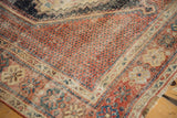 Hand knotted Afshar rug with mostly even wear, madder red field, and distinct blue geometric motifs.