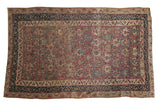 Antique Malayer rug, allover design of oversized floral blossoms in plum, navy, and ivory.