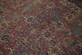 Intricate multi-panel floral blossoms on plum, navy, ivory antique Malayer rug, featuring low pile.