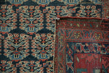 Antique Heriz carpet: allover boteh field in navy, blush, and ivory, with sturdy hand-knotted back.