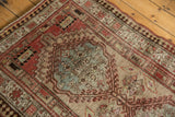 Vintage Serab runner's distressed low pile, serrated medallion, and faint foundation showing.