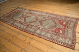 Distressed Serab runner end with pale raspberry red spandrel and pawn motif.
