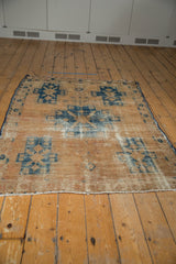 Distressed vintage Hamadan rug displaying localized wear and foundation etching.