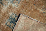Distressed vintage Hamadan rug pile with visible foundation etching and hand-knotted back.