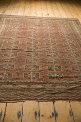 Distressed Afghan Bokhara rug corner with elephant footprint guls, chestnut, and oxidized silver.