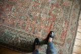 Distressed vintage Mehrivan carpet with oversized rectilinear geometric patterns in terra cotta and slate blue.